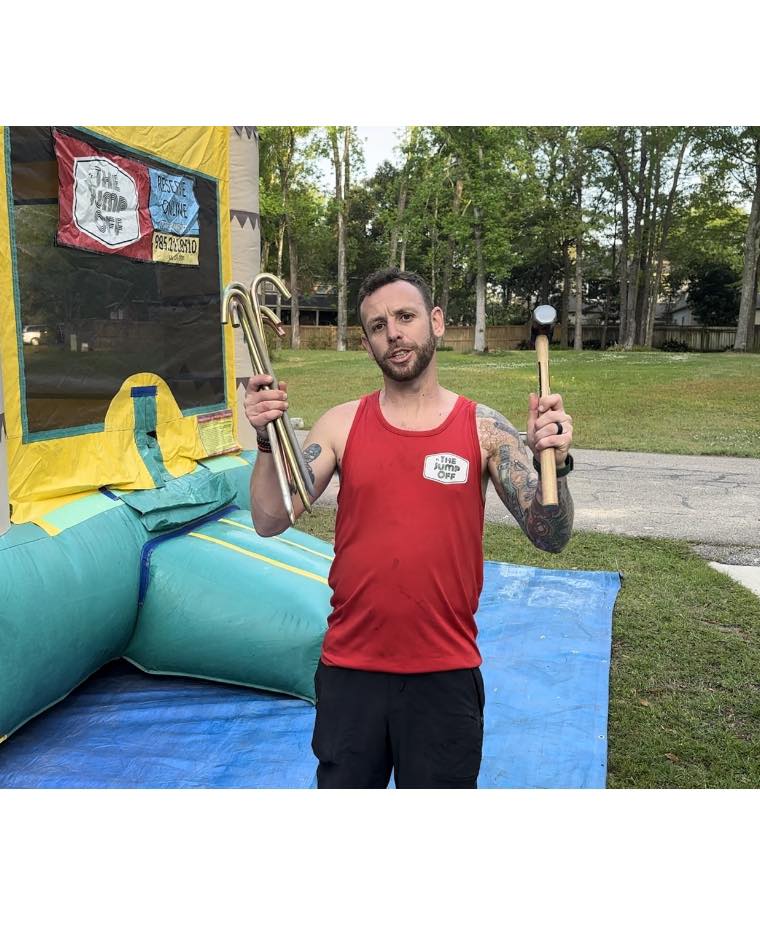 The Jump Off team setting up a bounce house rental