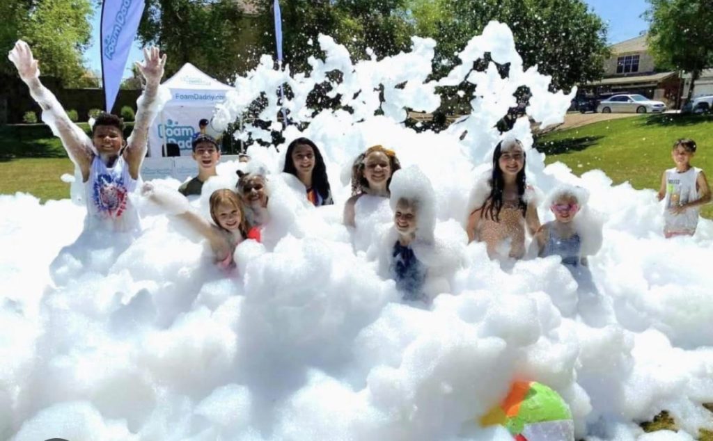 Foam party rental from The Jump Off at an outdoor event
