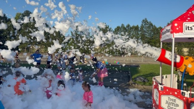 Pro Stacker foam cannon running outdoors on a sunny day