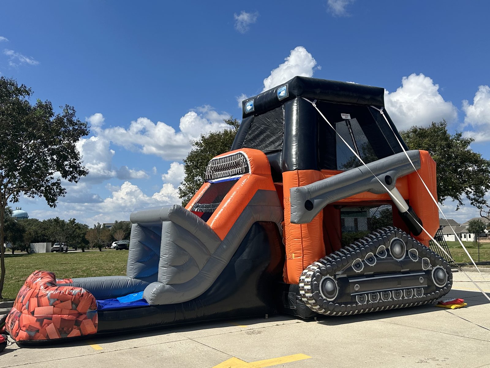 Skid steer bounce house with slide at the Slidell site of St. Tammany Sheriff Night Out Against Crime